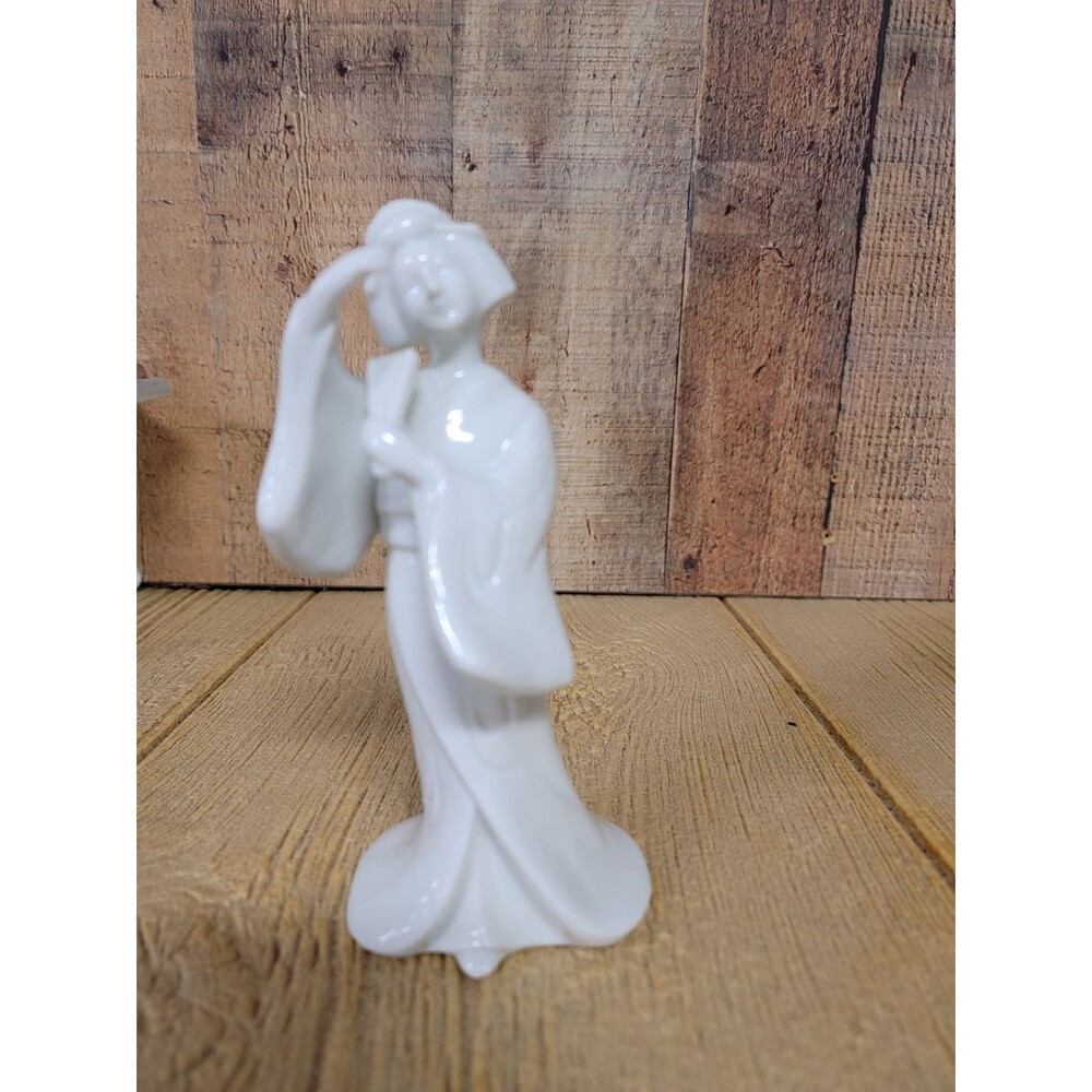 Porcelain Geisha woman dancing